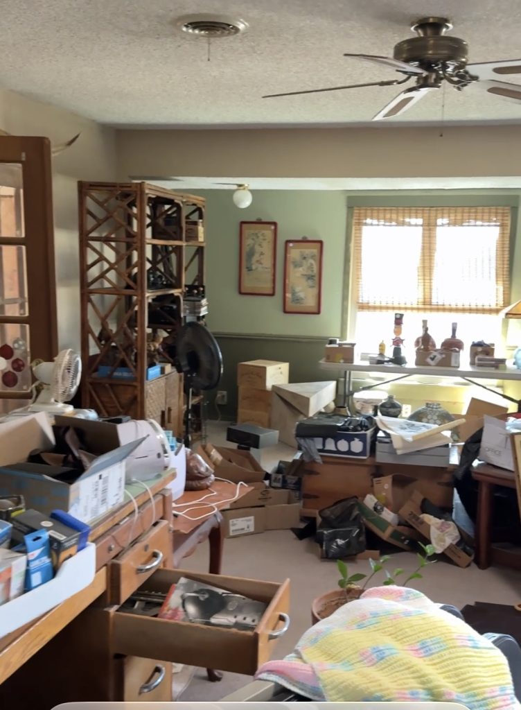 Before: the living area full of boxes and furniture